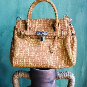 Bolso étnico morado y lima tejido a mano con estampado africano. Moda ética y exclusiva con esencia africana.