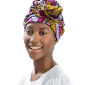 Turbante africano con motivos florales y tonos intensos tejido a mano. Pieza única con diseño, alma y valores.