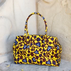 Bolso retro con estampado africano en marrón y amarillo. Hecho a mano. Apoya la moda consciente y solidaria.